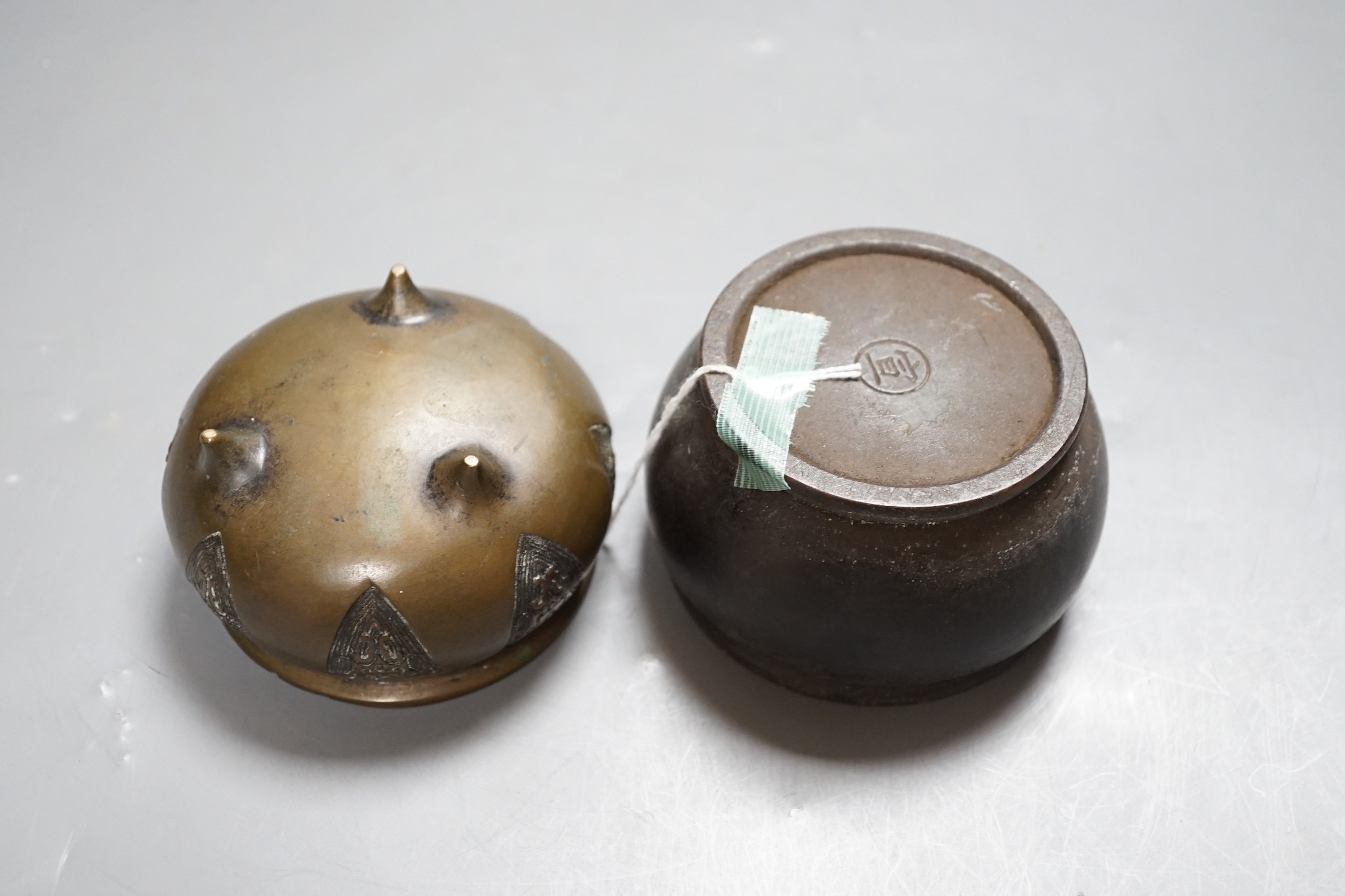 Two Chinese bronze censers, one inscribed, tallest 6cm